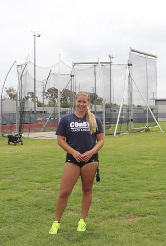 Abigail Gavrilovic in front of throwing circle at track and field practice
