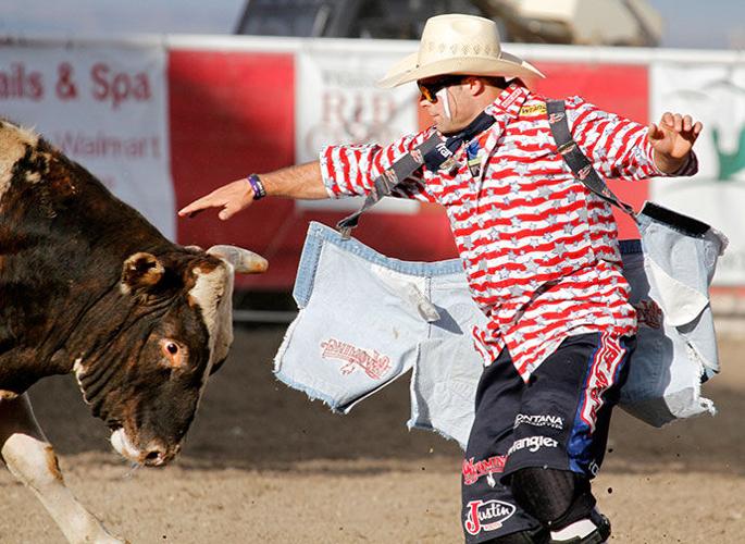 Professional Bull Riders bullfighters, from left, Cody Webster