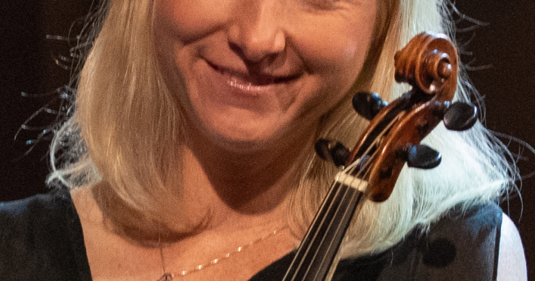 Musicians play period instruments in concert