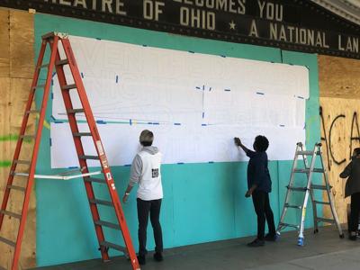 Murals Painted Over Boarded Up Windows After Protest Damage