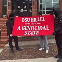 Masked individuals hold banner outside OSU Hillel calling Israel ‘genocidal state’