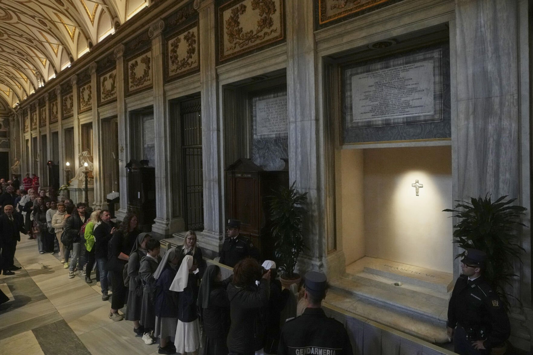 Catholics pay respects as pope's tomb opens to public