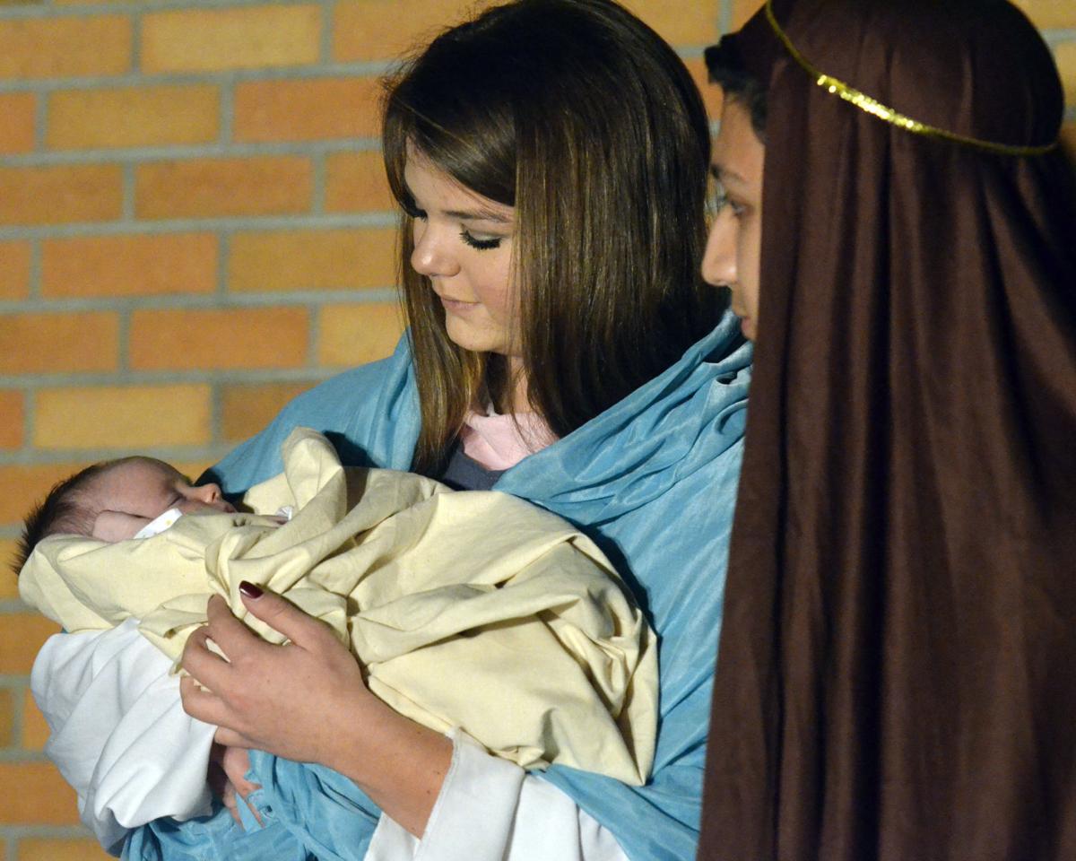 Kameryn Healy who is holding Elli Oehlrich and Candido Morales portray Mary Baby Jesus and Joseph respectively during the annual Christmas pageant