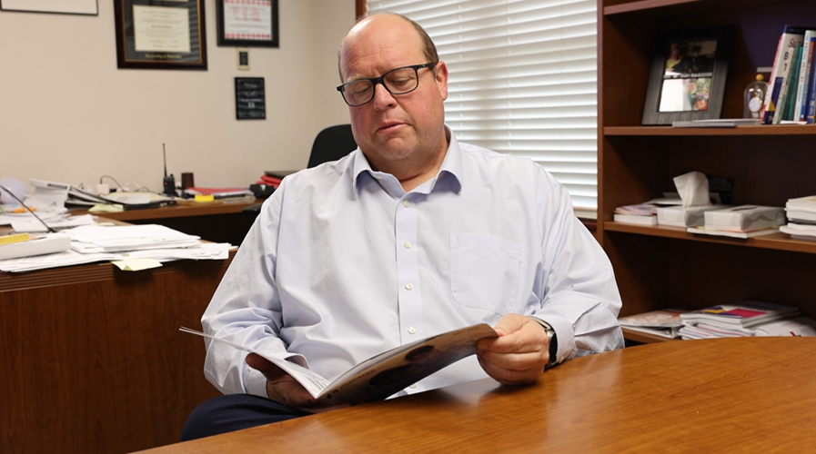 Schroder reading Schuyler Schools annual report