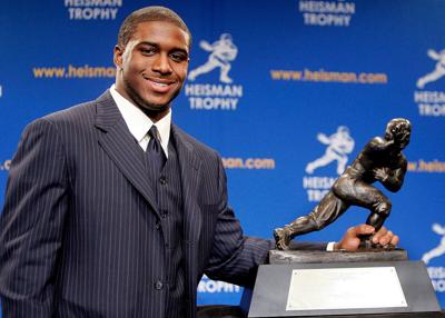 Running back Reggie Bush of the USC Trojans poses with the 2005 Heisman trophy after winning the award at the 71st Annual Heisman Ceremony on Dec. 10, 2005, in New York City.