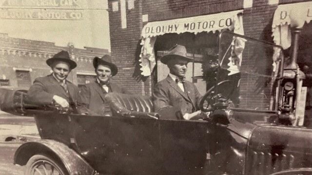 The Dlouhy Bbrothers in front of Dlouhy Motor Company
