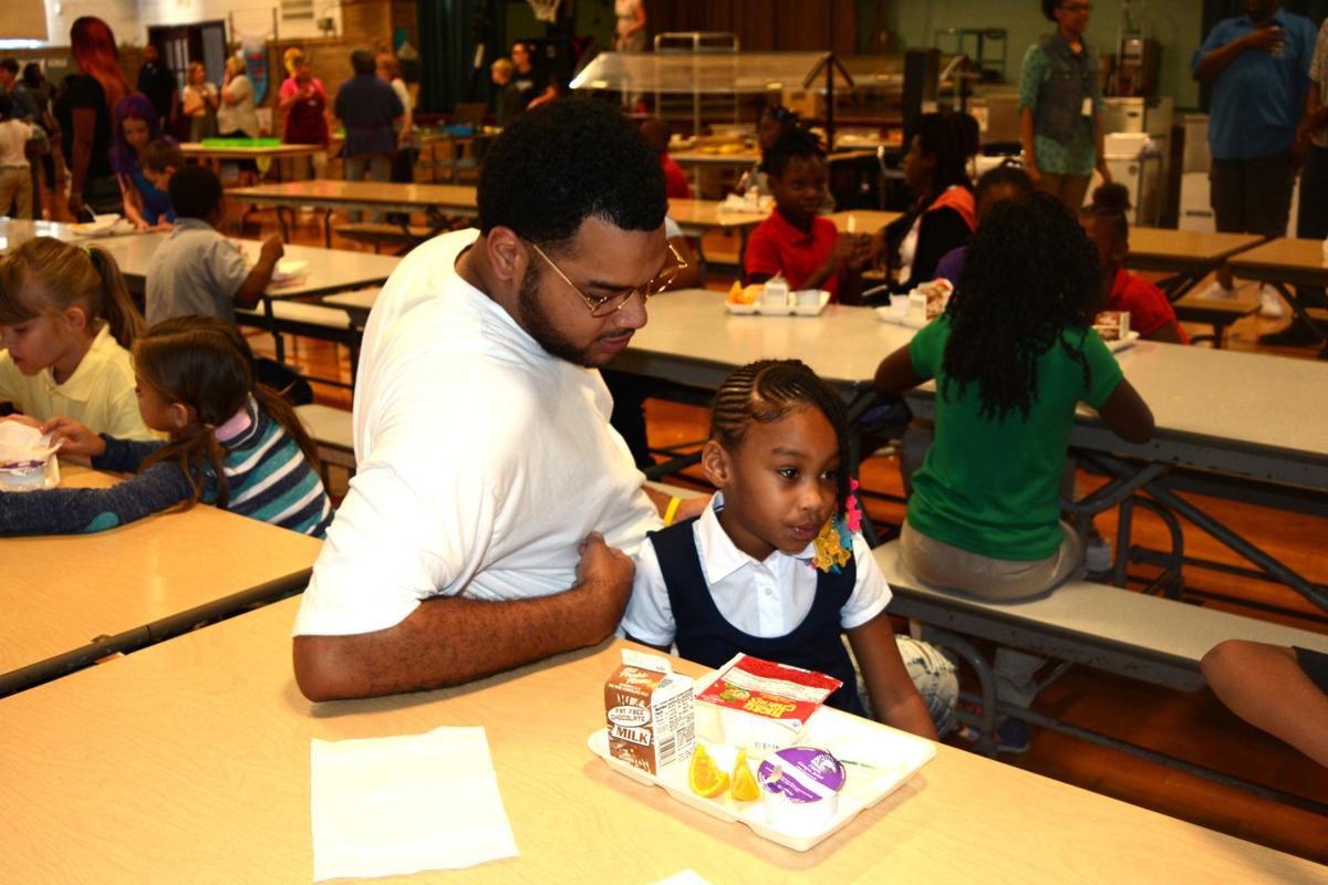 Fathers join children for first day of school