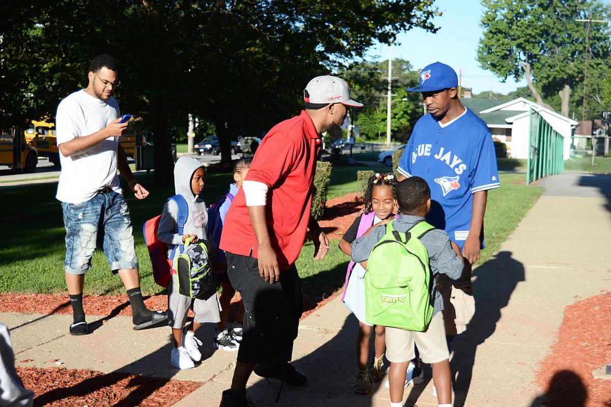 Fathers join children for first day of school