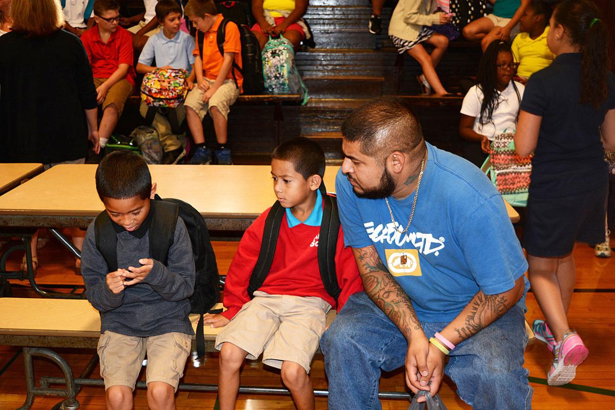 Fathers join children for first day of school