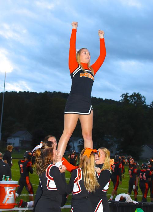 Cheerleaders lead fans Friday night
