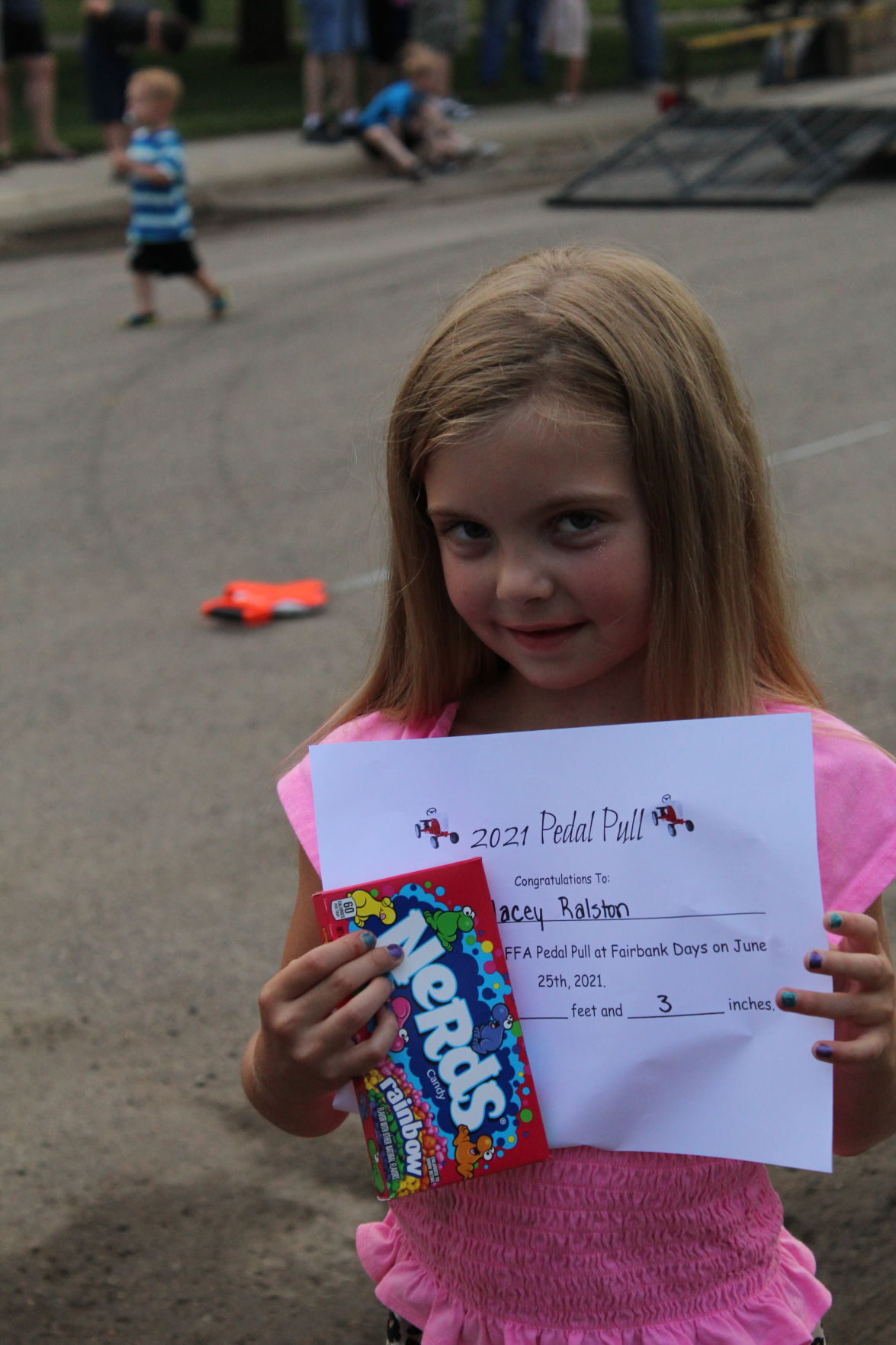 Macey Ralston, 6, girls' pedal pull second-place certificate