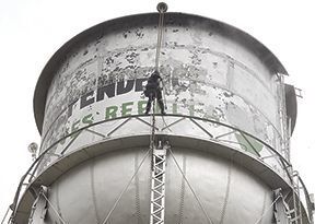 UT water tower spray painted over