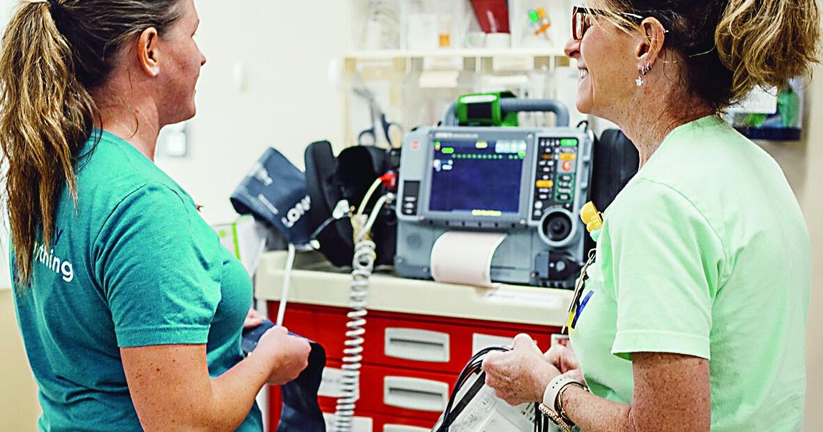 Mother/daughter, caring for patients side by side
