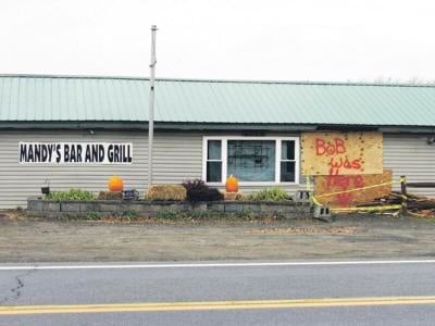 Man charged with DWI after crash into bar