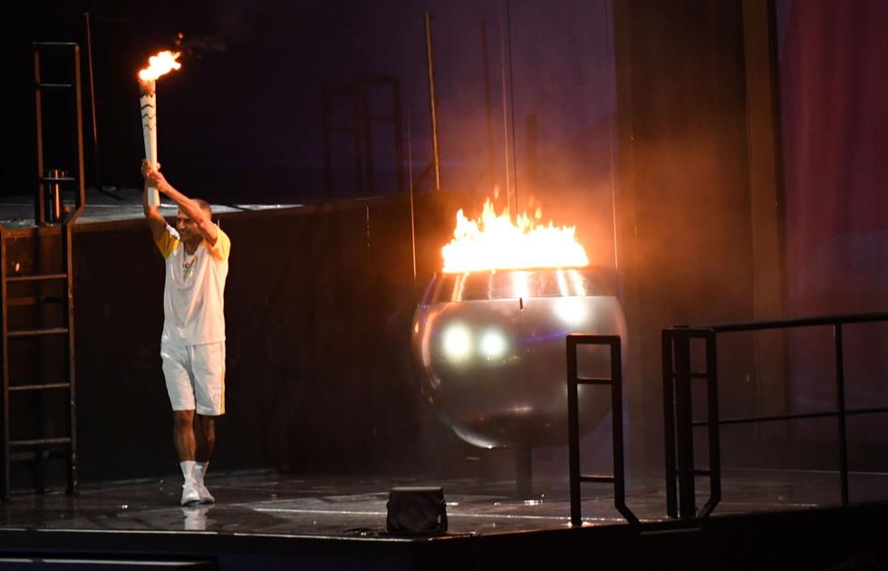 Olympics: Olympic flame lands in Japan as doubts grow over Tokyo Games