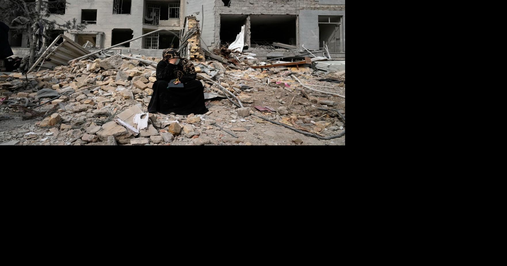 The Latest: Airstrike pounds Iranian pro-government rally as war threatens global economy