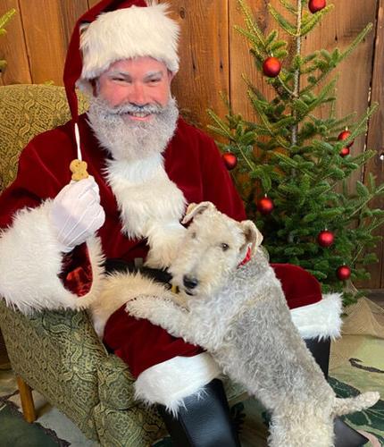 Santa poses with a pet