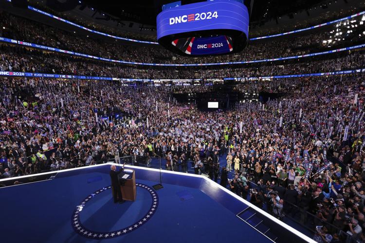 Biden gets a rousing ovation from Democrats as he gives Harris an