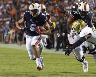 College Football No 7 Auburn Routs Alabama State 63 9