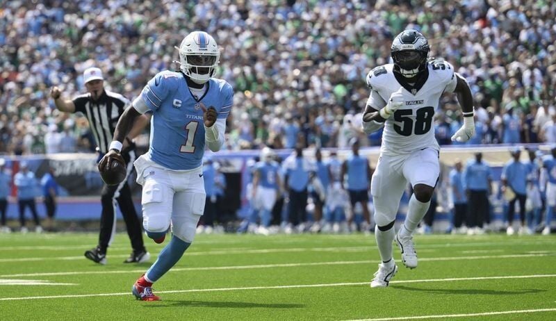 Cam Ward running with the football during the Titans game