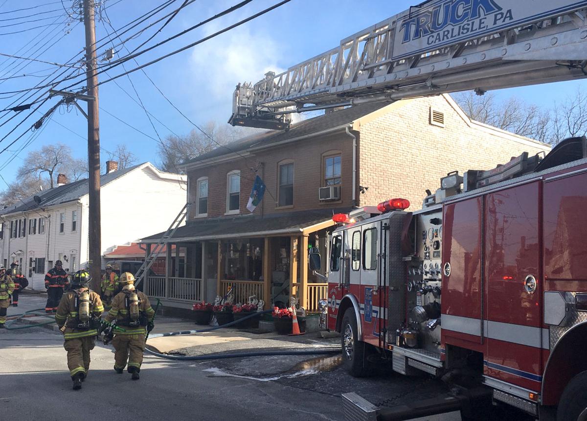 Crews battle frigid temperatures to contain house fire in Carlisle