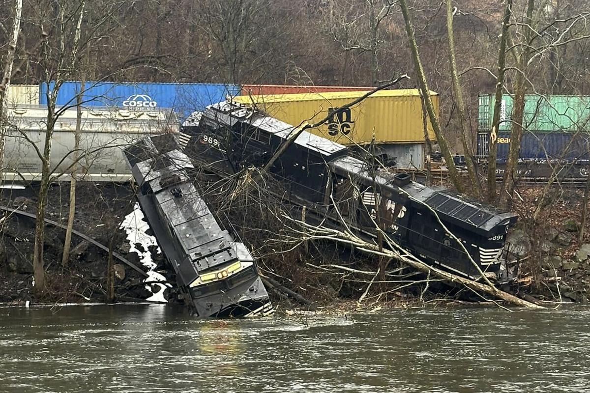 Pa. train derailment leaves cars on riverbank or in water; no injuries