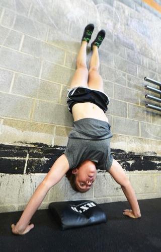 How To Do a Handstand Push-up, According to CrossFit Coaches.