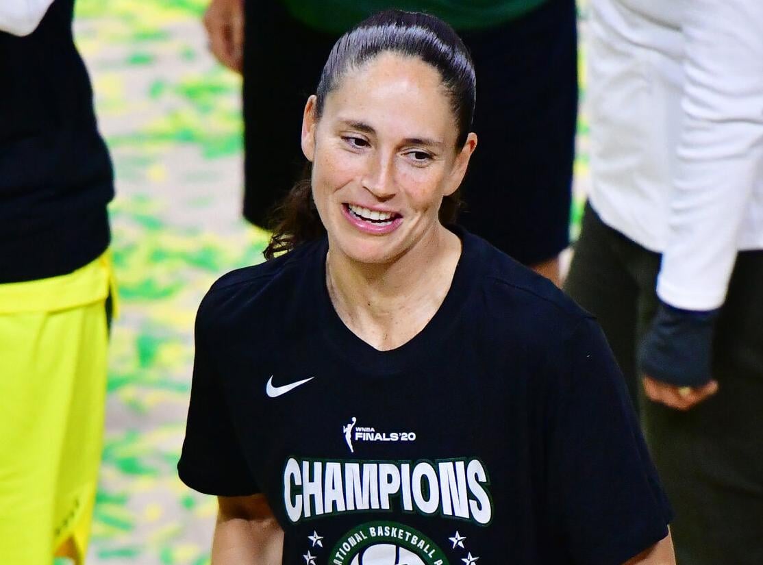 Sue Bird of the Seattle Storm looks on while holding on to the WNBA Championship trophy after defeating the Las Vegas Aces during Game 3 of the WNBA Finals at Feld Entertainment Center on October 6, 2020, in Palmetto, Florida.