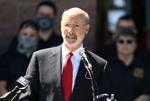 Wolf vetoes bills on poll watchers, transgender athletes