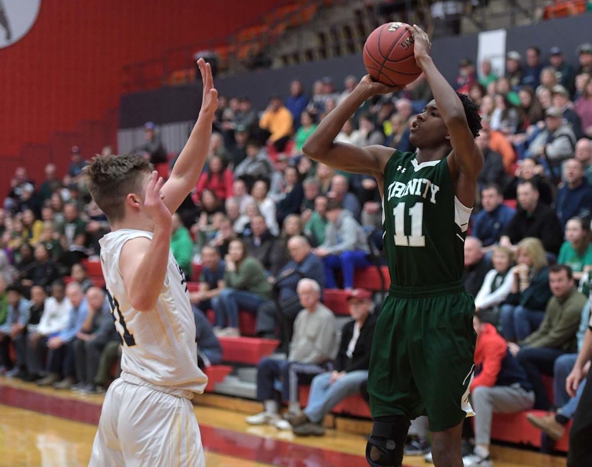 Piaa Boys Basketball Trinity S Block Party Patience Vs New Hope Trinity S Chance Westry Right Shoots A Three Point Shot In Front Of New Hope Solebury Logan Waterman The Piaa Cl 3a Quarterfinals Saay