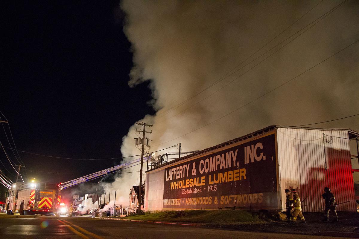 Massive fire consumes lumber yard, burns through the night The