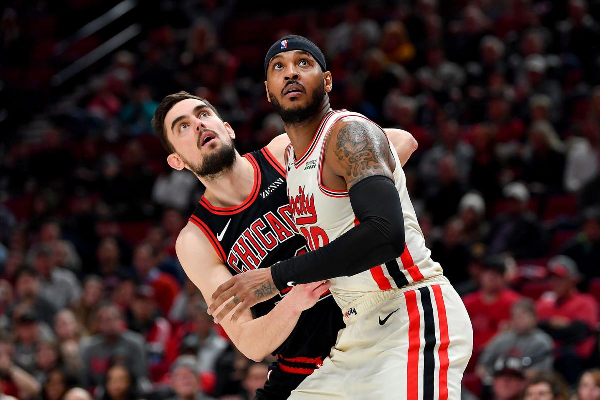 Carmelo Anthony (00) of the Portland Trail Blazers and Tomas Satoransky (31) of the Chicago Bulls battle for a rebound during the second half on Nov. 29, 2019 at the Moda Center in Portland, Ore.