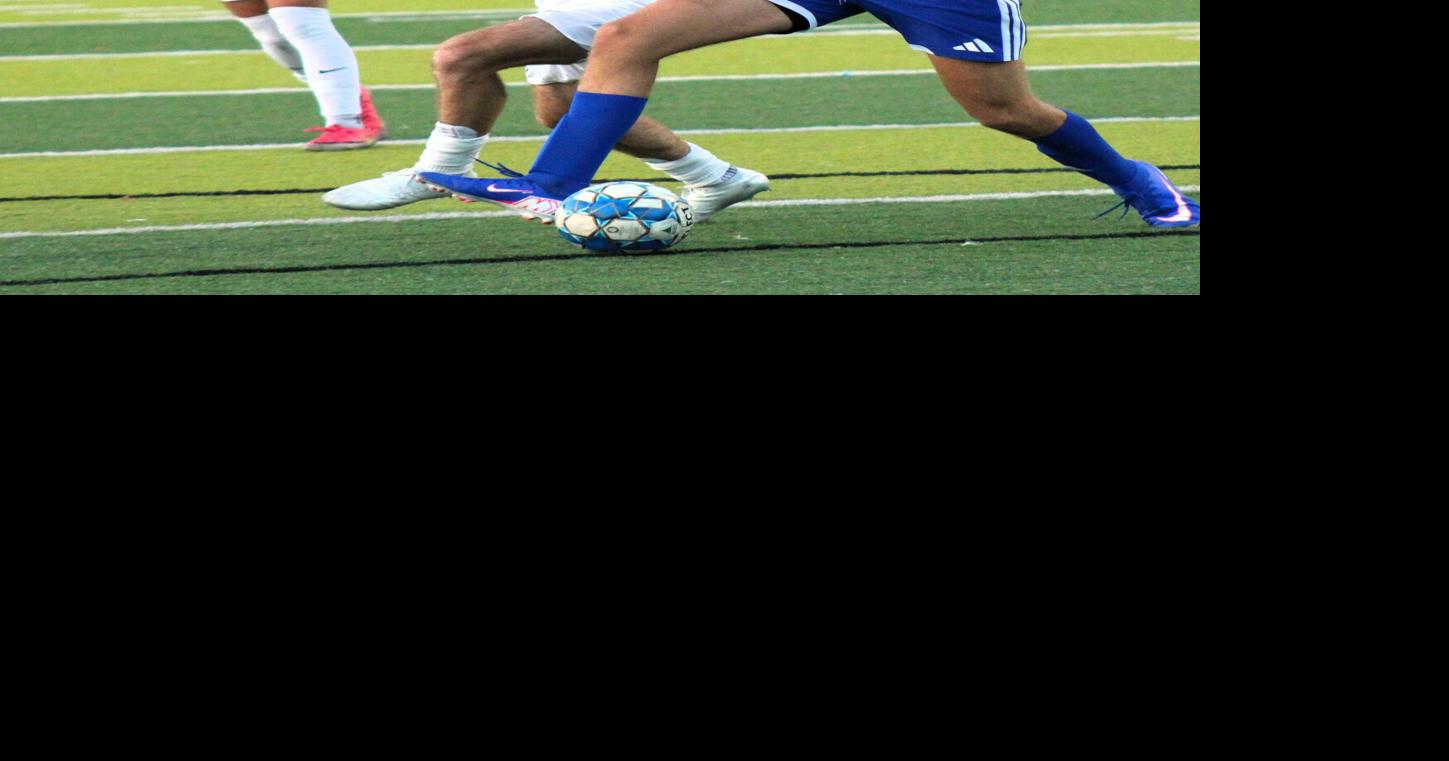 Beaman fights for control of the ball