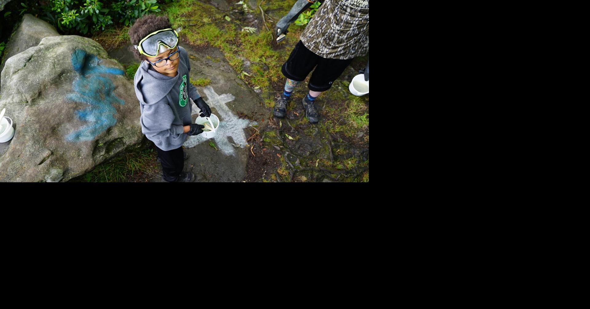 Volunteers help remove graffiti at Forbes State Forest