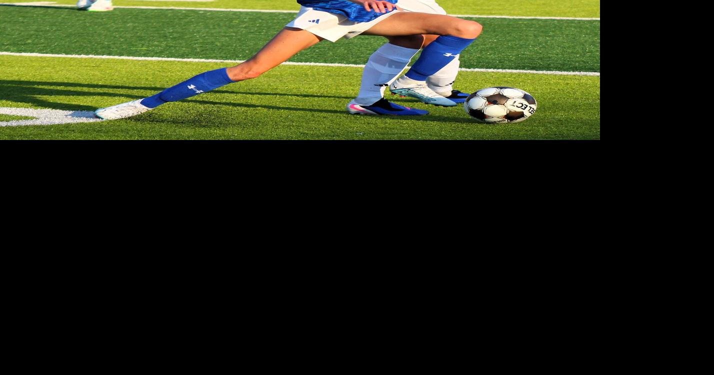 Bandemer battles Wright for the ball