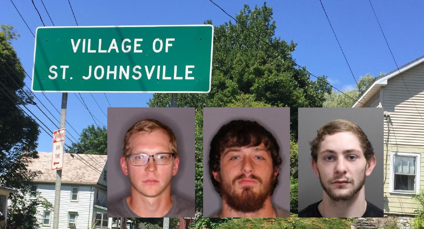 Two arrested, one wanted in theft of wooden cow cutout in St