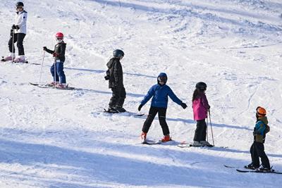 Skiers practice their slalom skills at Maple Ski Ridge in Rotterdam