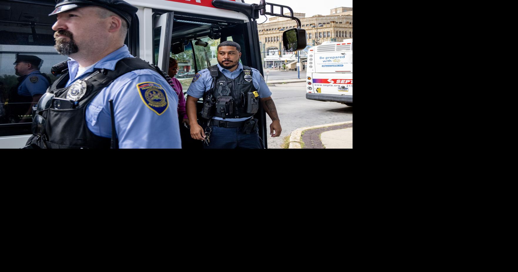 SEPTA transit police patrol officers Brendan Dougherty and Nicholas Epps with the Fare Evasion Unit leave the Rt. 21 bus at the 69th Street Terminal in 2025..