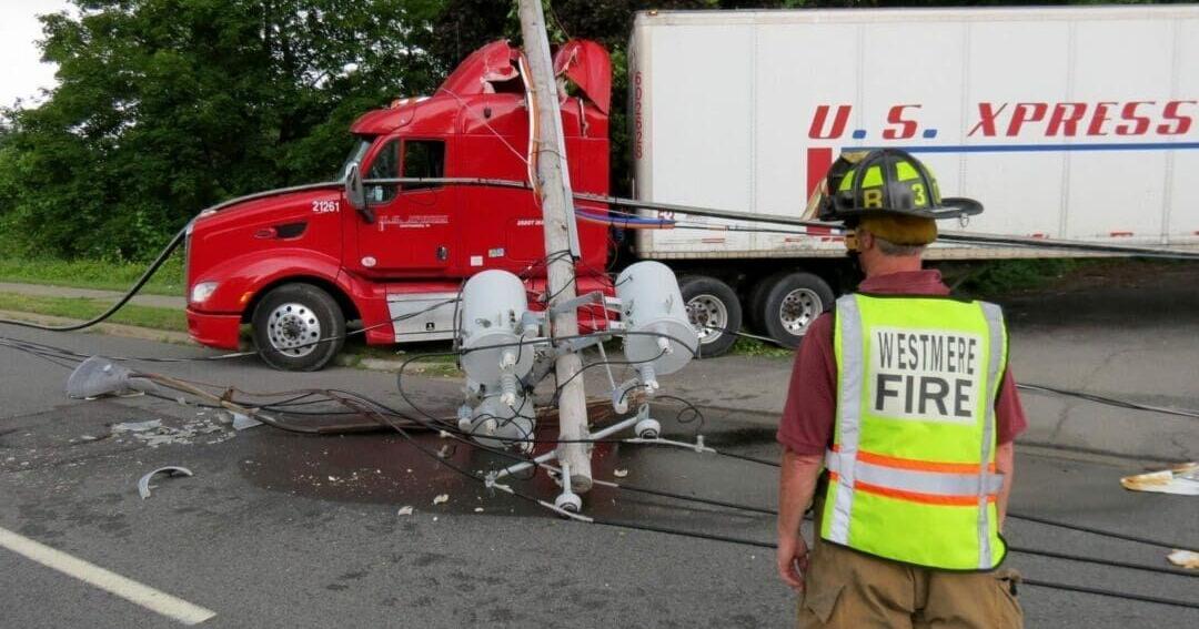 Truck driver trapped after crashing into power lines | News ...