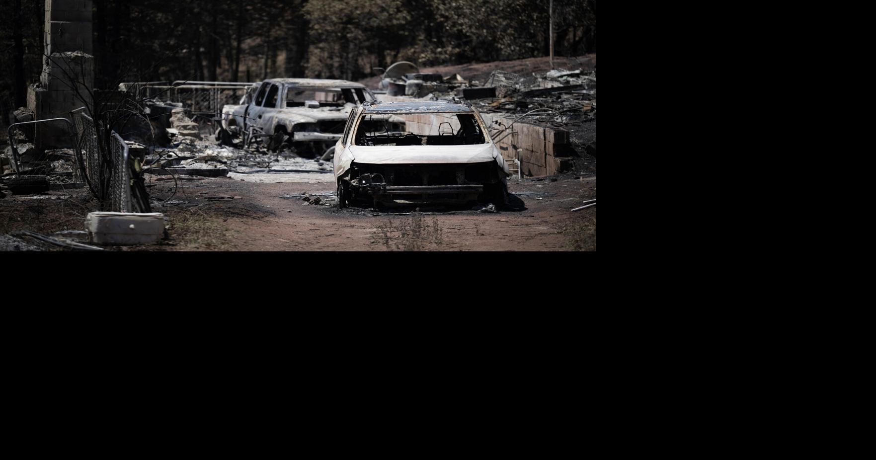 Burned-out vehicles are seen on a property on July 15, 2026, in Beulah, Colorado.
