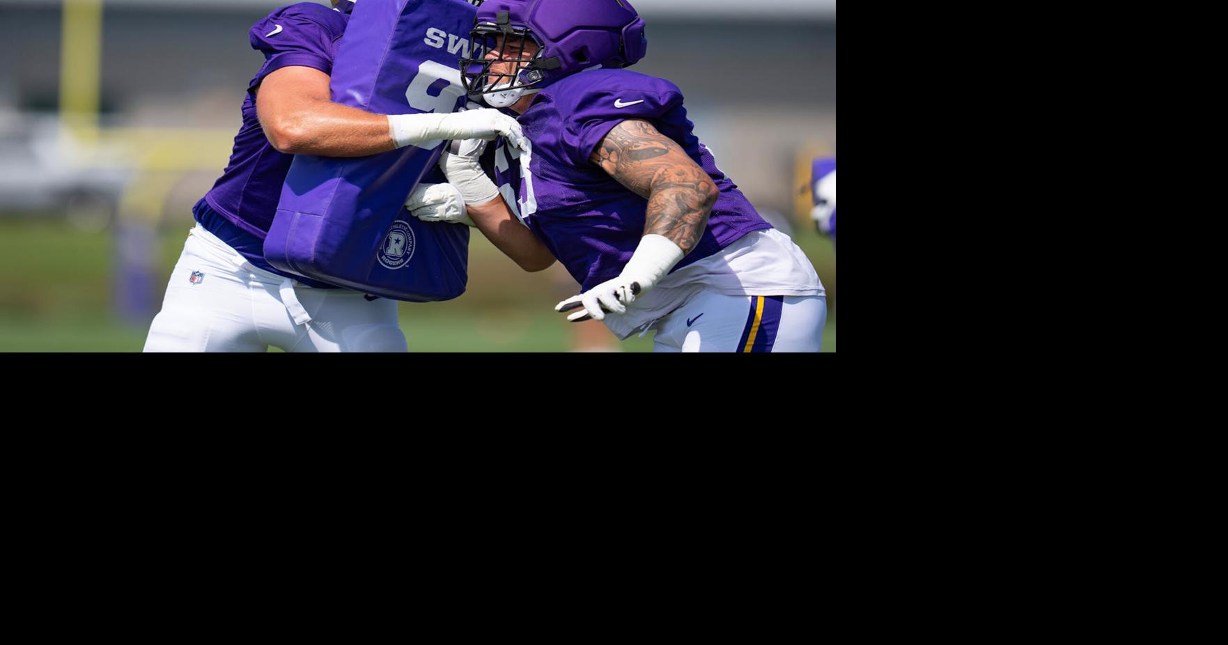 Minnesota Vikings offensive lineman Tristan Leigh, right, is trying to make the team in training camp as an undrafted rookie out of Clemson.