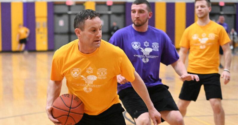 Amsterdam teachers, staff take on local first responders in charity basketball game