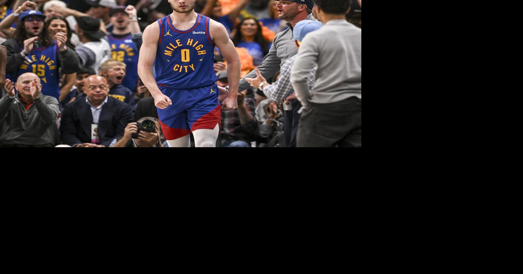 Christian Braun of the Denver Nuggets flexes after scoring while being fouled during the first quarter against the Minnesota Timberwolves at Ball Arena in Denver on Monday, April 20, 2026.