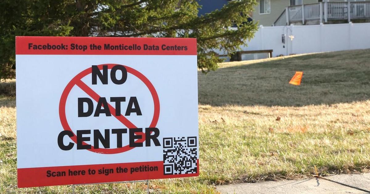 Residents near a proposed data center display in Monticello, Minnesota, display lawn signs protesting the project.