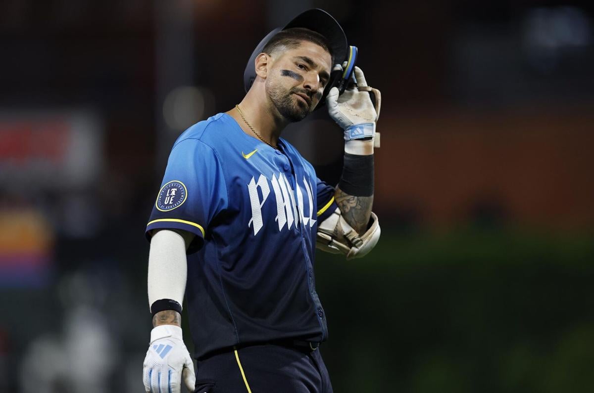 Nick Castellanos of the Philadelphia Phillies tips his helmet during a game