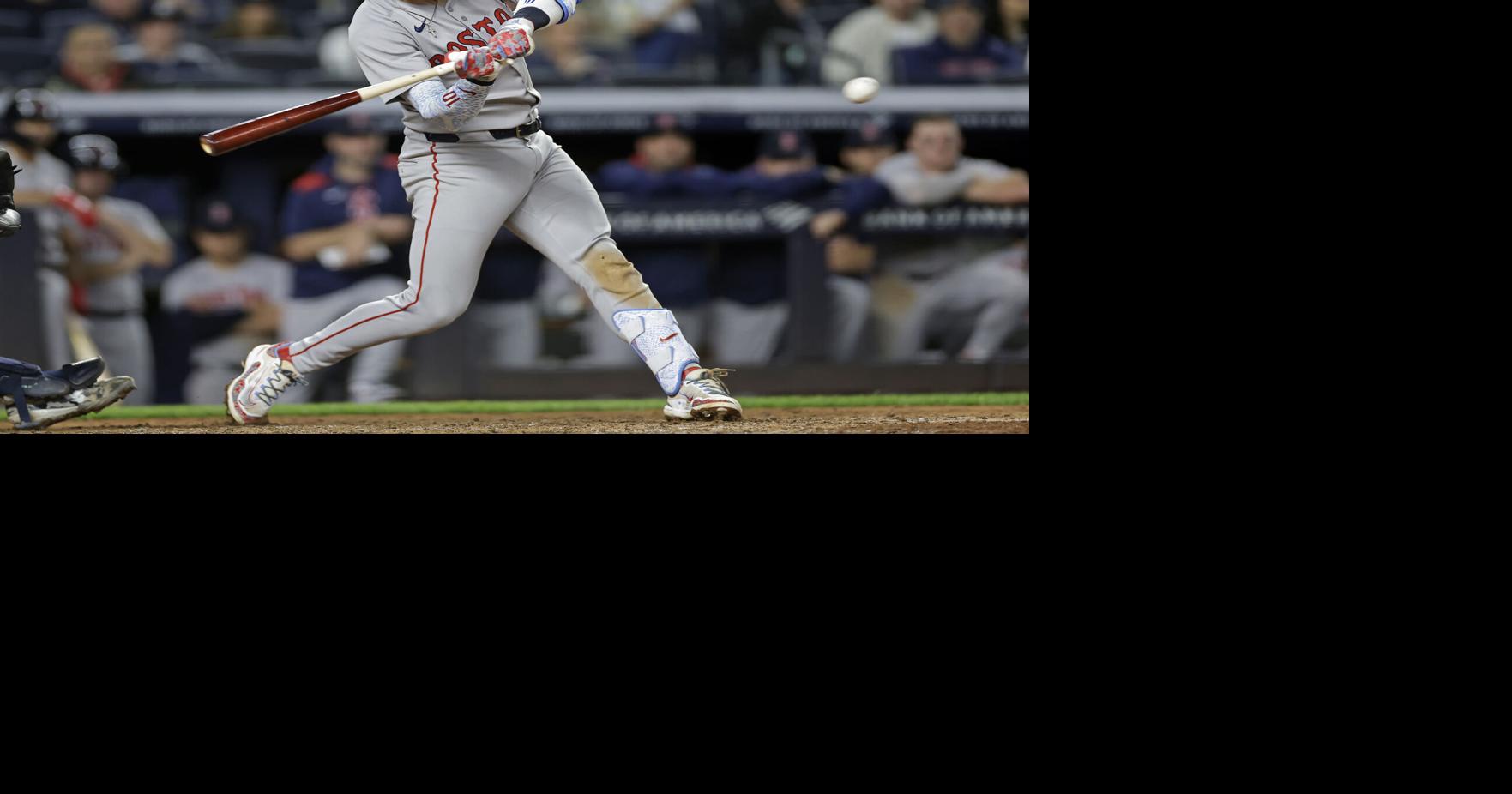 Trevor Story of the Boston Red Sox hits an RBI single during the ninth inning against the New York Yankees at Yankee Stadium on Saturday, June 7, 2025, in New York.