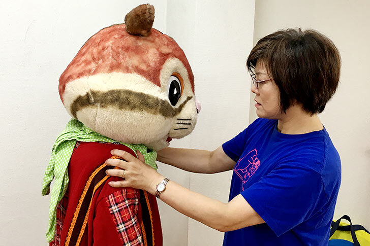 This photograph shows a plush toy representing the mascot of the