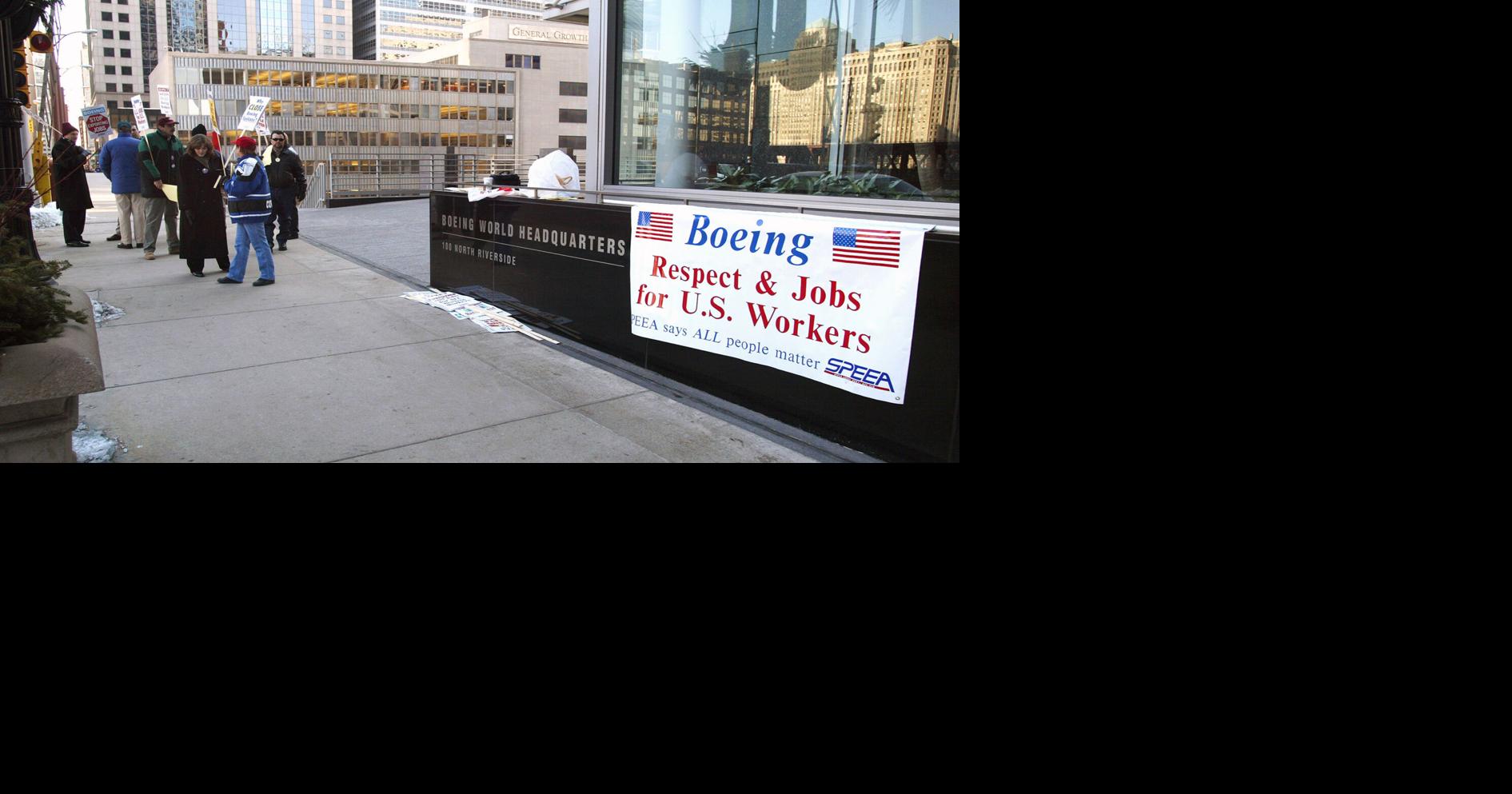 Demonstrators picket outside Boeing World Headquarters on Feb. 5, 2002, in Chicago, Illinois.