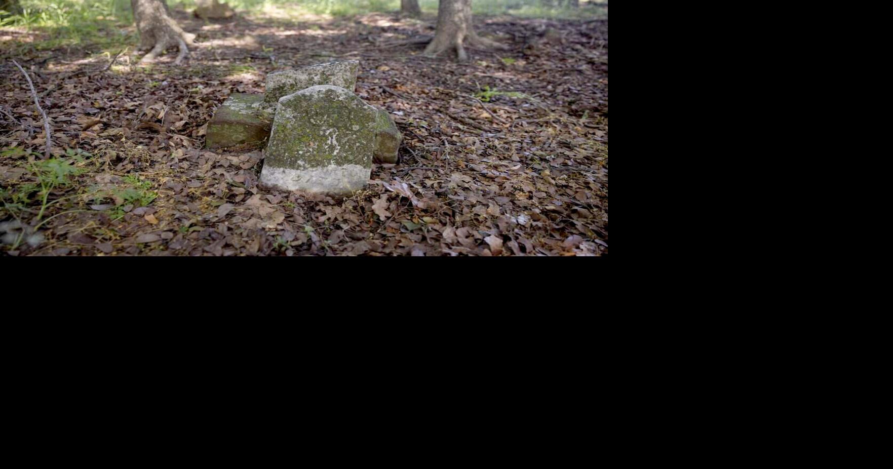 A damaged grave marks the place where someone is buried at St. John's Cemetery on Saturday, May 9, 2026 in Denton, Texas.