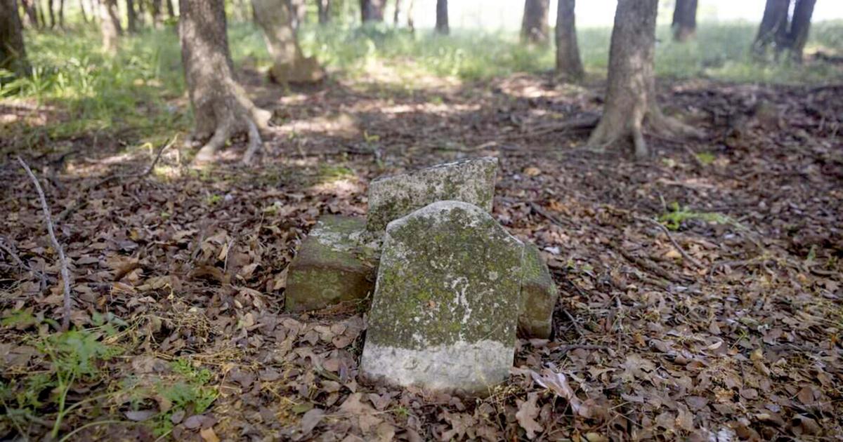 A damaged grave marks the place where someone is buried at St. John's Cemetery on Saturday, May 9, 2026 in Denton, Texas.